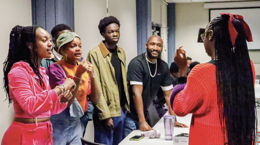 Members of the Black Student Union on South Campus play a card game at one of the Black History Month events. This event is one of five that the organization has been able to schedule.